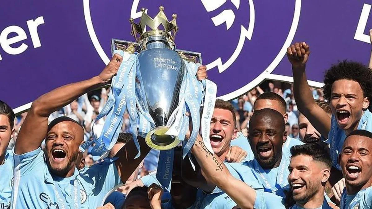 Manchester City players lifting the Premier League trophy in 2018