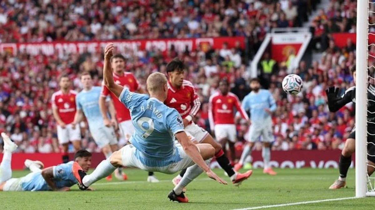 Manchester City striker Erling Haaland scores against Manchester United