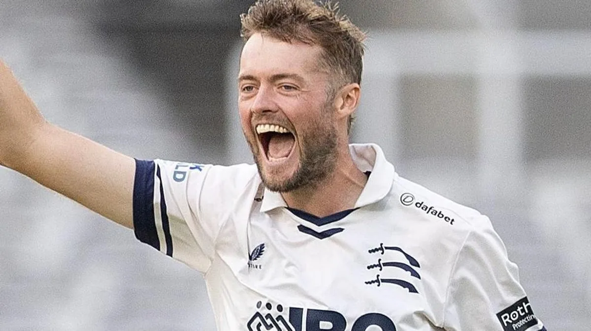 Tom Helm celebrates taking a wicket