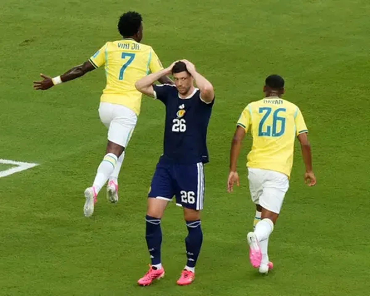 Scott McKenna reacts to Vinícius Júnior’s goal for Brazil against Scotland at the 2026 World Cup