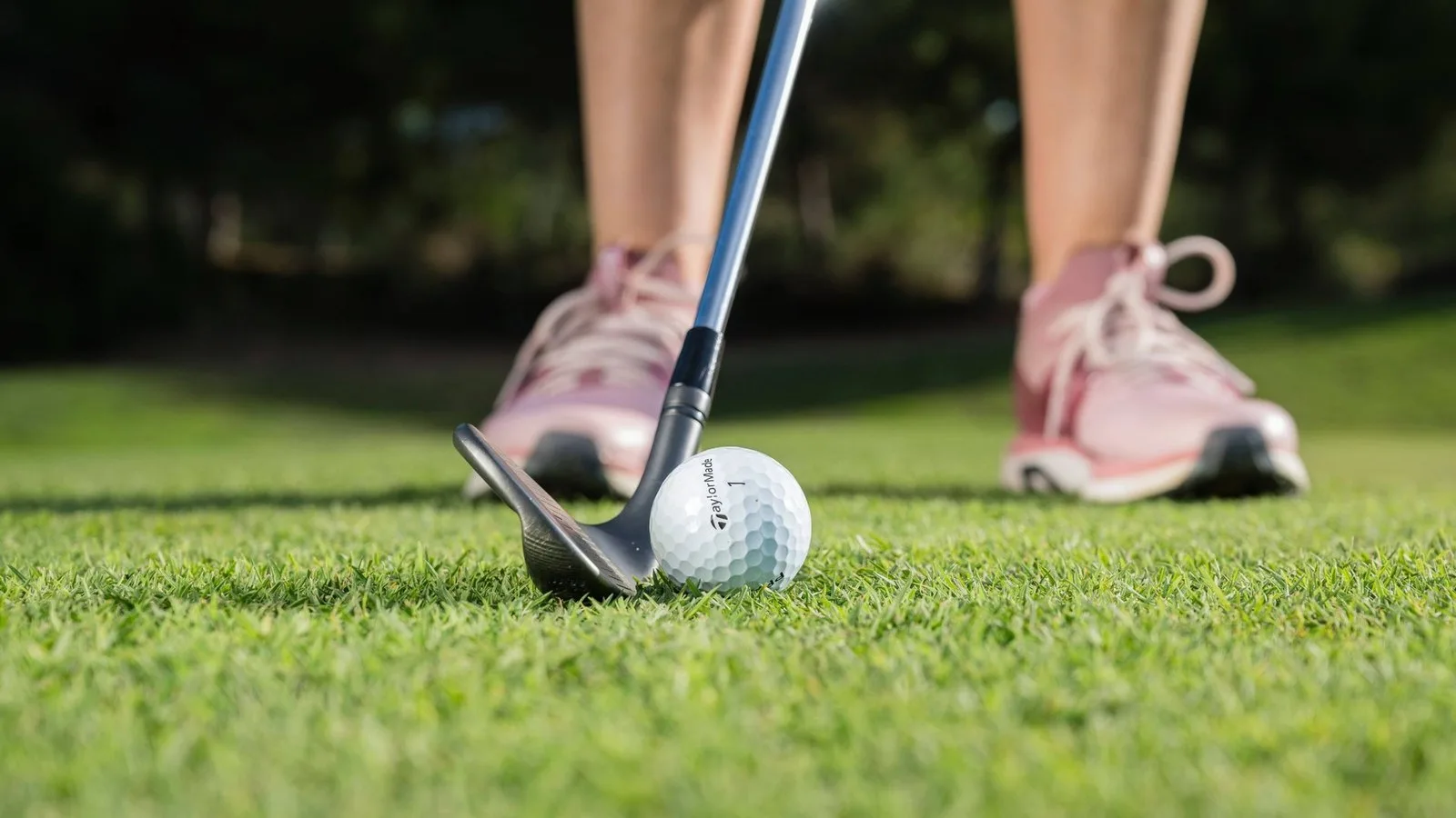 Ball positioned back for a chip shot