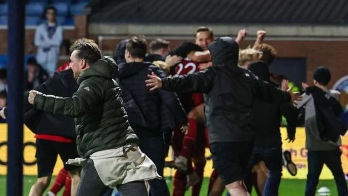 Aberdeen fans spill on to the pitch at Rugby Park