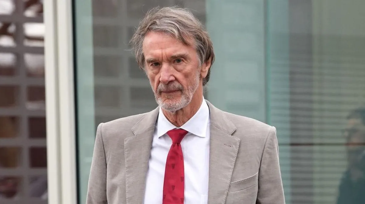 Sir Jim Ratcliffe in light-coloured smart jacket, white shirt and red tie