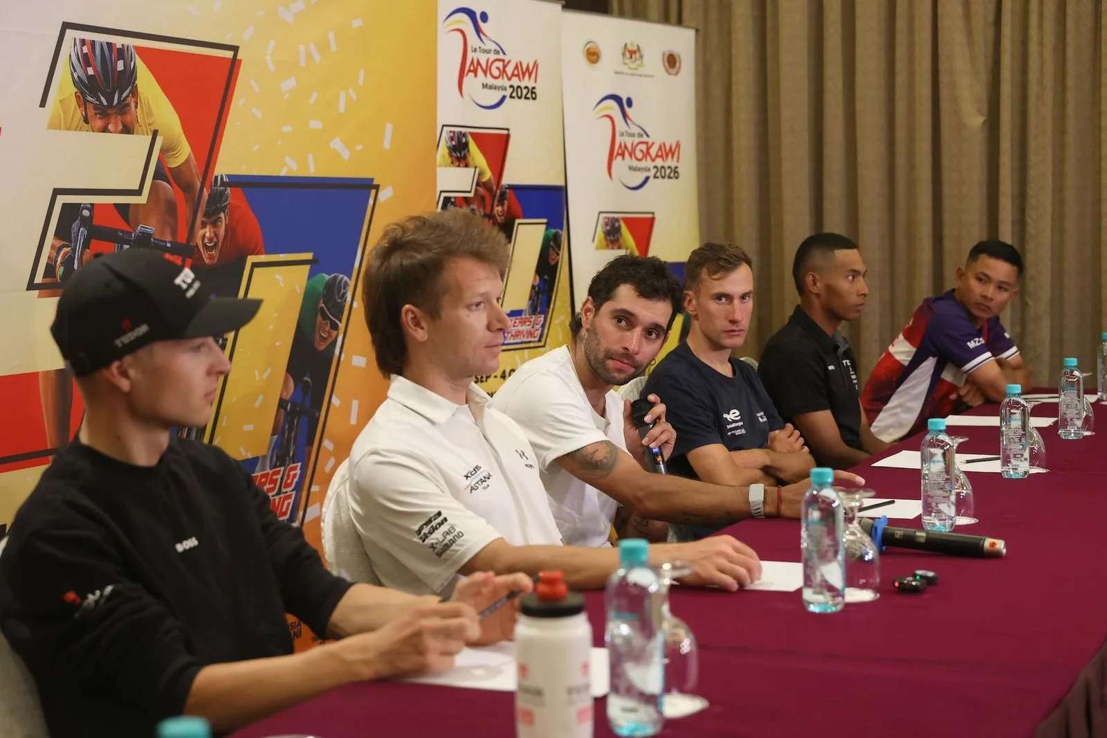 Tour de Langkawi 2026 pre-race press conference with (L-R) Lennart Jasch (Tudor), Aaron Gate (XDS Astana), Fernando Gaviria (Caja Rural-Seguros RGA), Geoffrey Bouchard (Total Energies), Aiman Rosli (Terengganu) and Muhammad Izzat Hilmi (Malaysia Pro Cycling)
