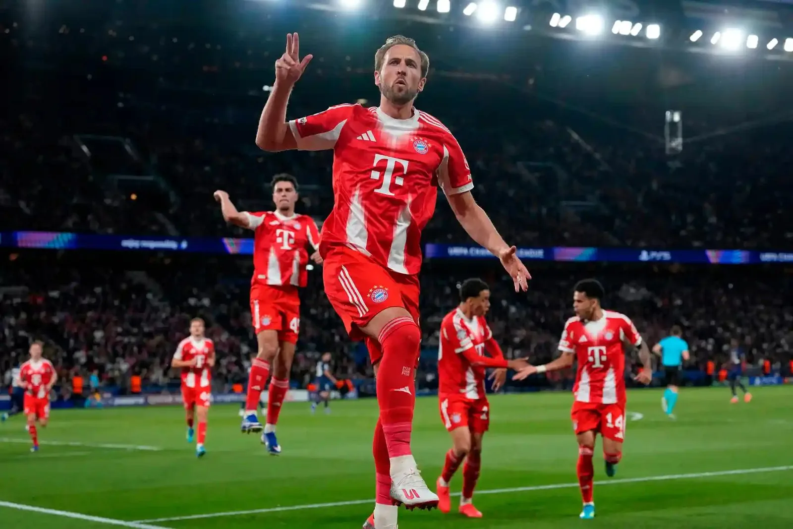 Harry Kane celebrates with raised fingers after scoring a penalty for Bayern Munich