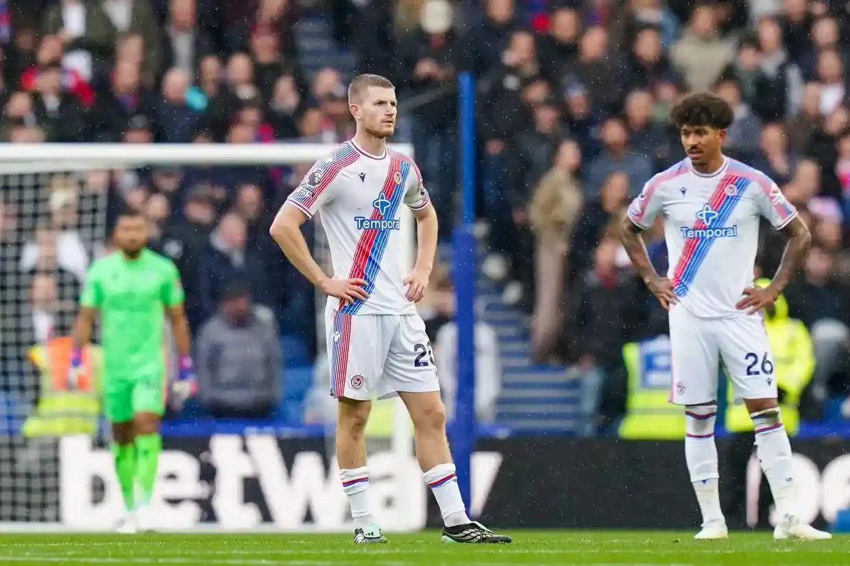 Crystal Palace’s Adam Wharton and teammate stand dejected after conceding a goal