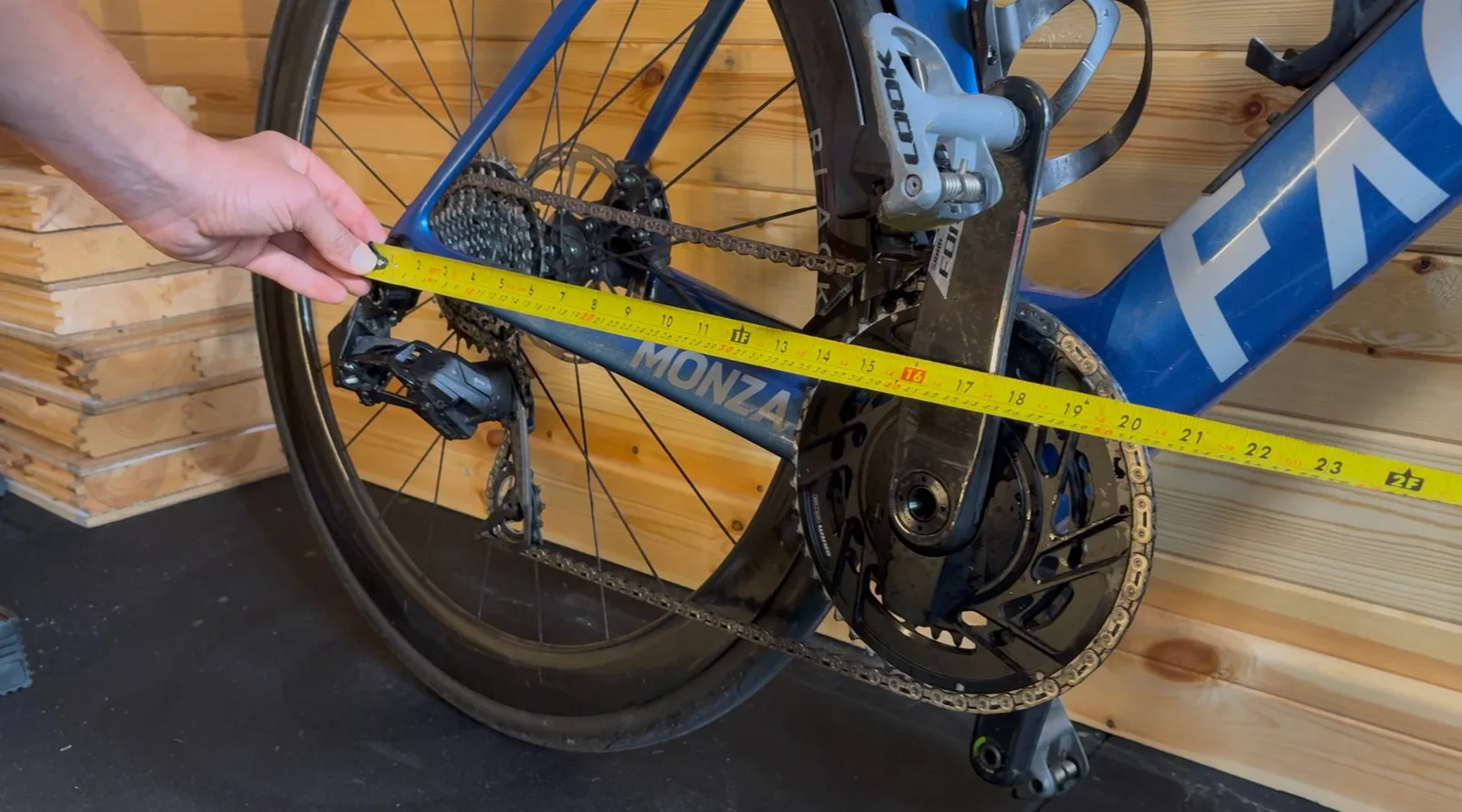Steve measures the wheelbase on a blue Factor Monza road bike