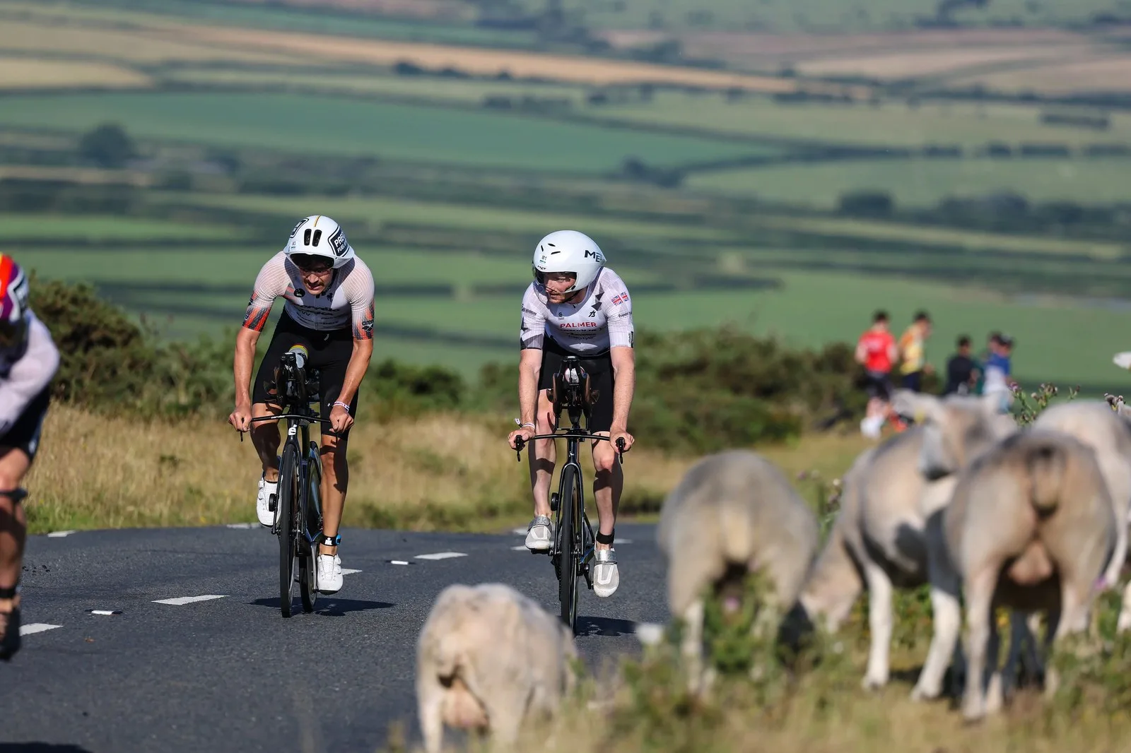 SWANSEA, WALES - JULY 13: Harry Palmer (R) of Great Britain competes in the bike section of Ironman 70.3 Swansea July 13, 2025 in Swansea, Wales.