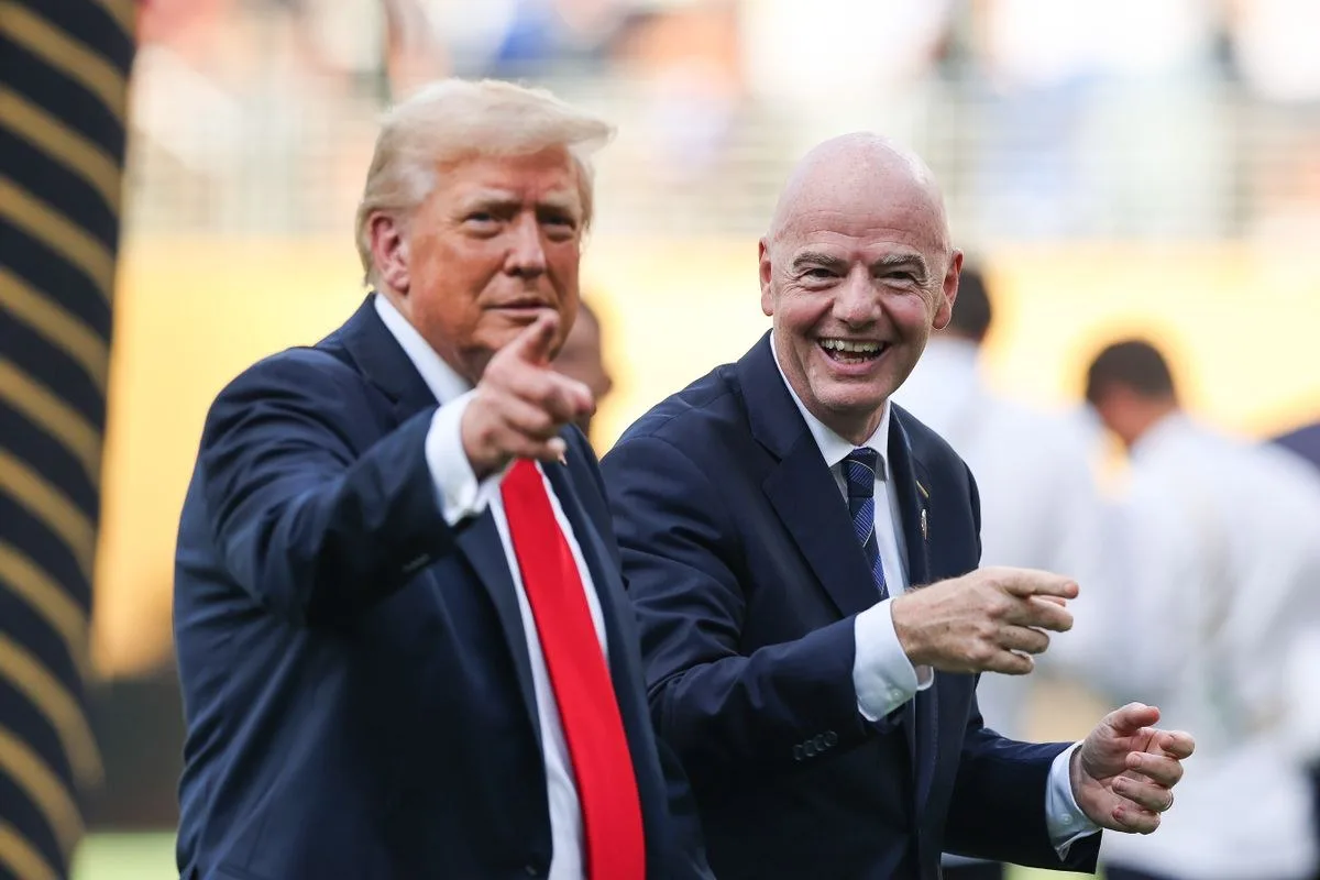 Donald Trumo (L) and Gianni Infantino (R) at the FIFA Club World Cup Final, pointing, smiling.