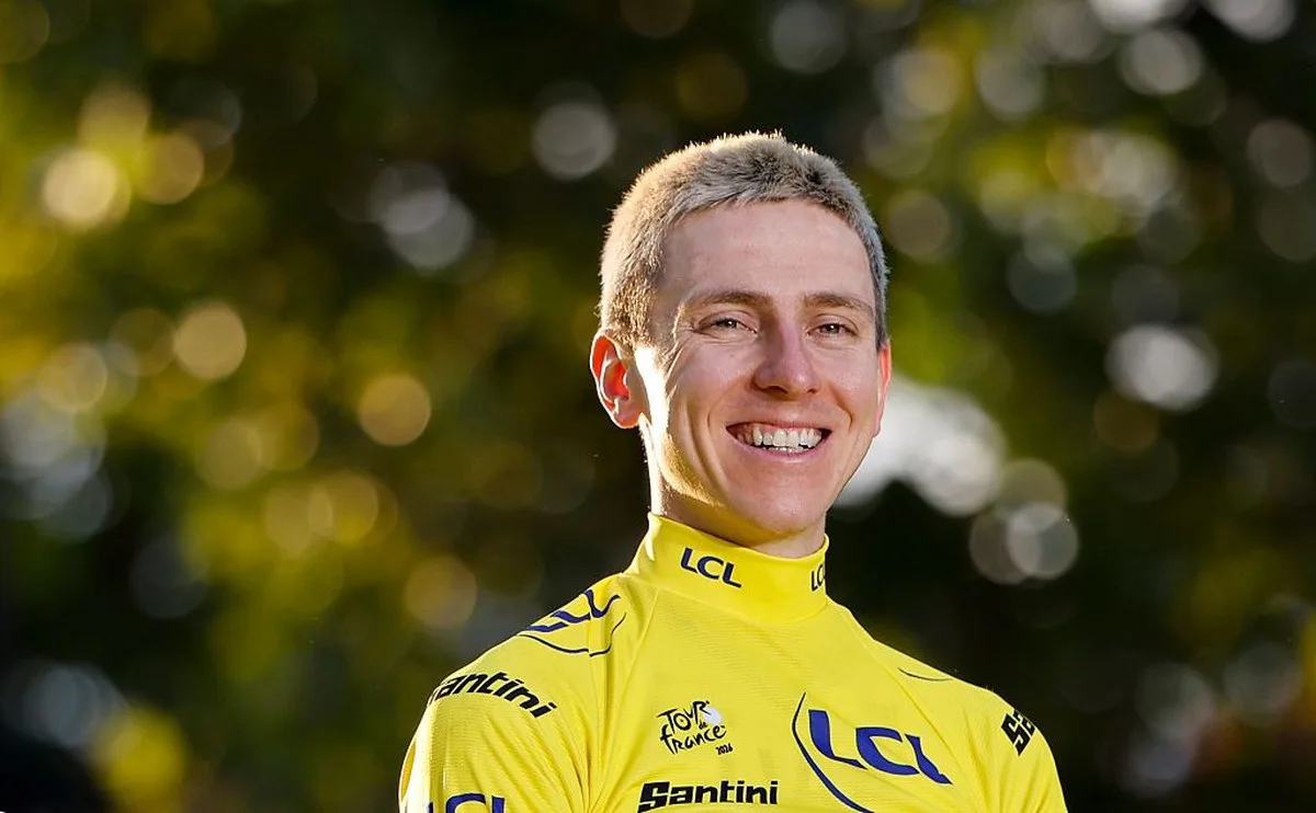 Tadej Pogačar wears the yellow jersey atop the final podium of the 2026 Tour de France in Paris