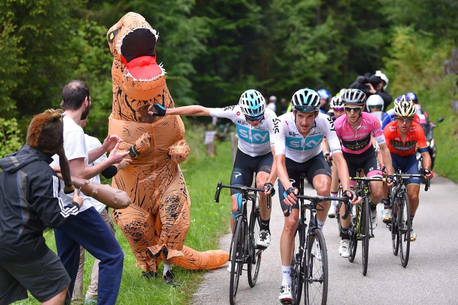 Christopher Froome of Team Sky pushes away a fan during the Giro d'Italia 2018, Stage 14 on May 19, 2018 in Monte Zoncolan, Italy