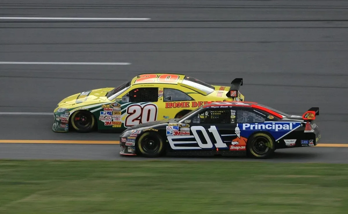 Regan Smith, No. 01, battles Tony Stewart, No. 20, for race win