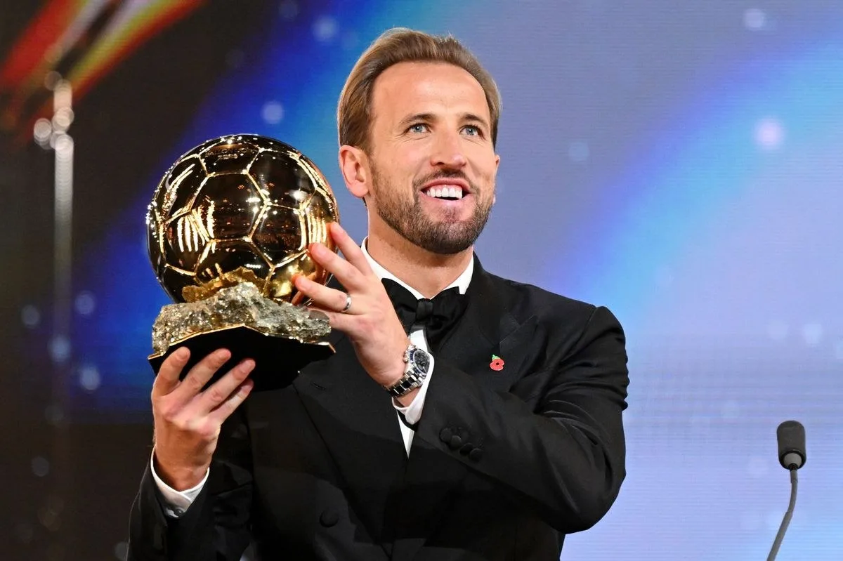 Harry Kane holding the 2026 Ballon d'Or