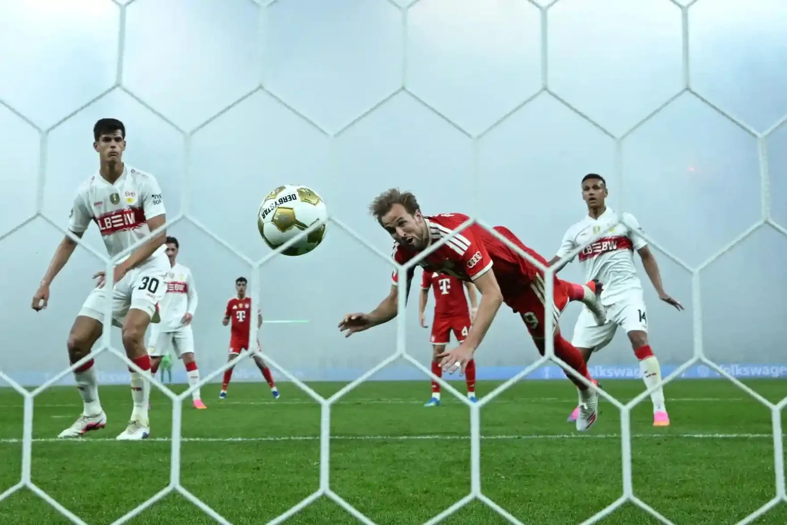 Bayern Munich’s Harry Kane heads home against Stuttgart