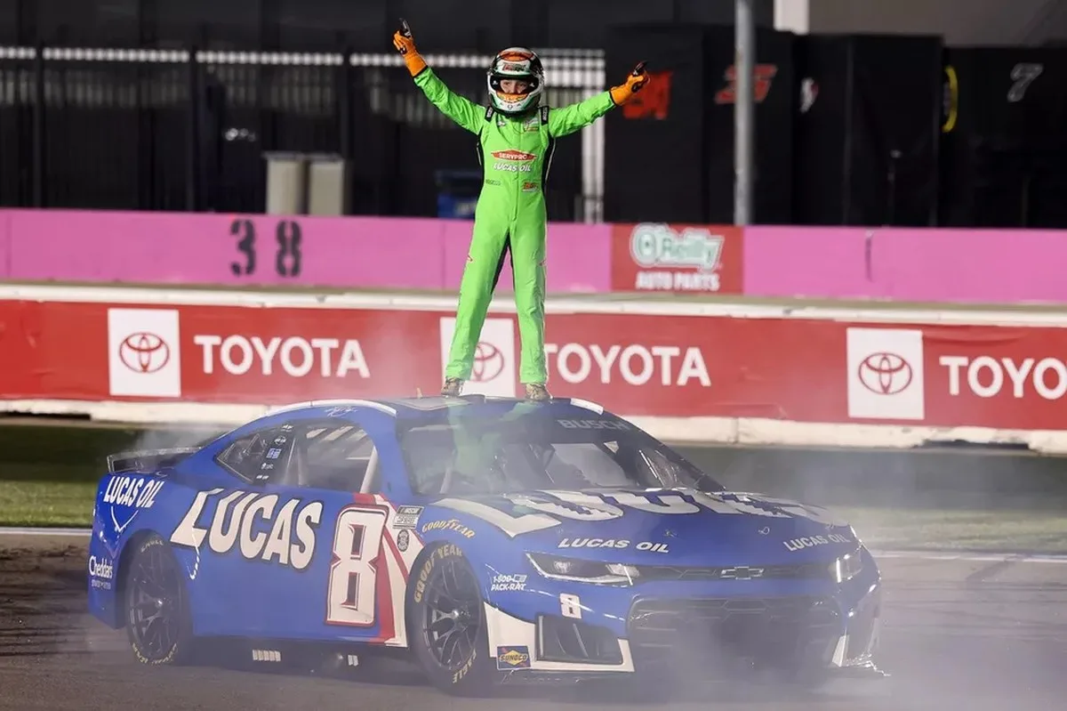 Brexton Busch stands atop his father Kyle Busch's Richard Childress Racing Chevrolet